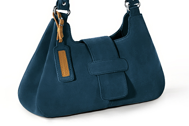 Handcrafted women's luxurious elegant handbag in premium peacock blue leather. Perfect for elevated everyday style.   
                Choose from our luxurious collections of leather and fabric to perfectly match your handbags to your outfits.